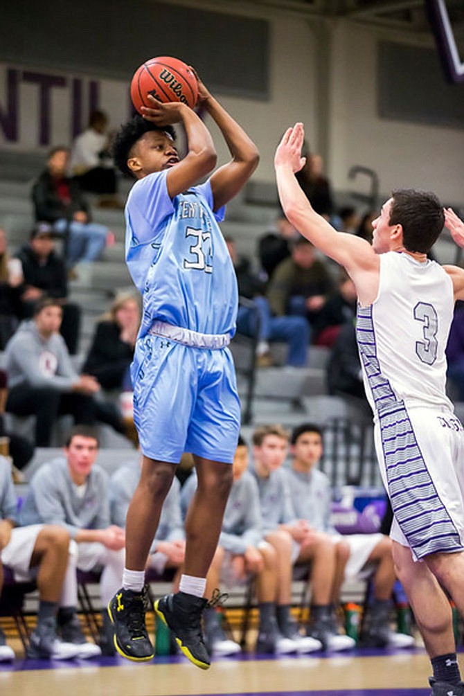 Bryce Douglas #33 elevates for a jump shot and avoids Christian Parana #3. Douglas led all scores with 23 points