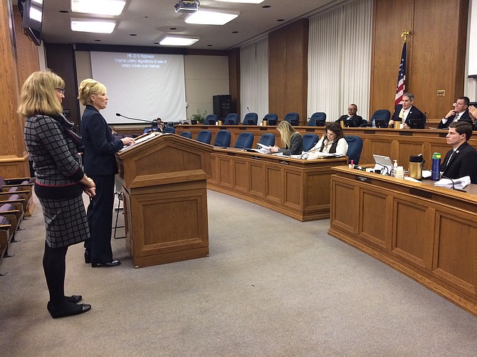  Del. Roxann Robinson (R-27) and Virginia Lottery executive director Paula Otto, left, appear before a subcommittee of the House General Laws Committee. 