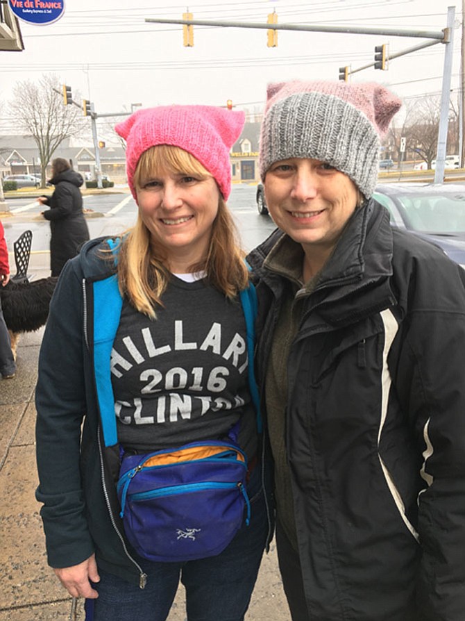 Barbara Bernstein, of Potomac, and Chris Nickerson, a friend from Boston, stop for coffee and sandwiches on their way to the Women's March in Washington Saturday.