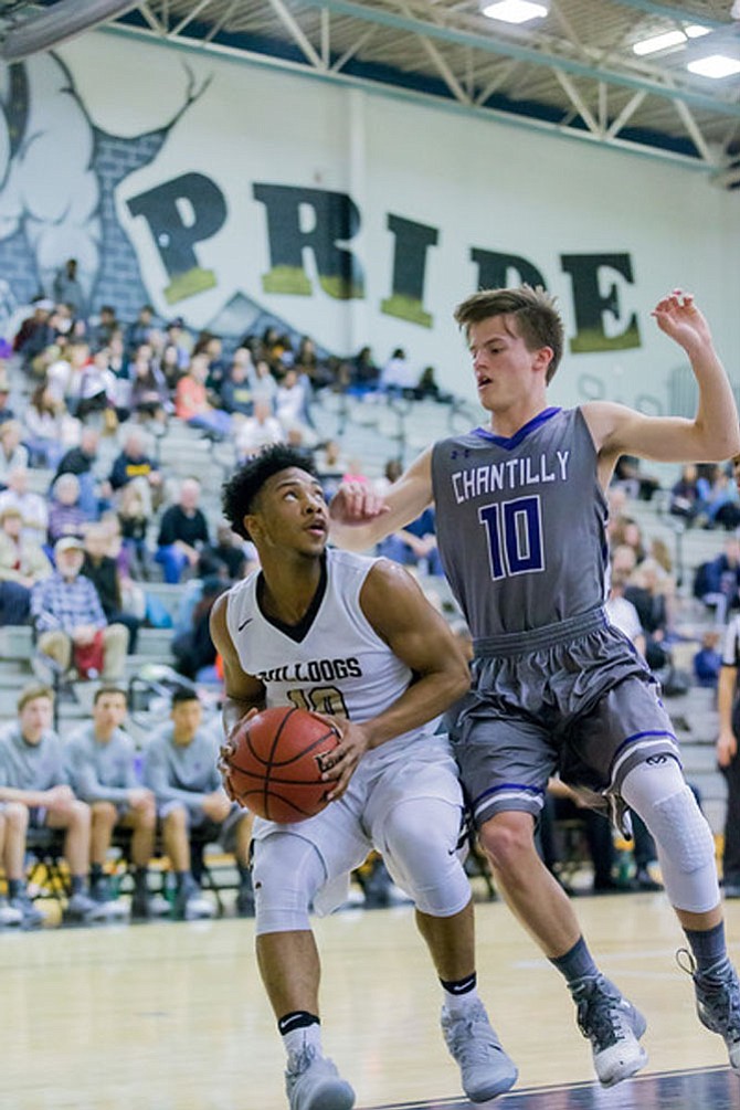 DJ Gregory #10 is focused on the hoop while Chantilly's Bret Caslavka #10 defends