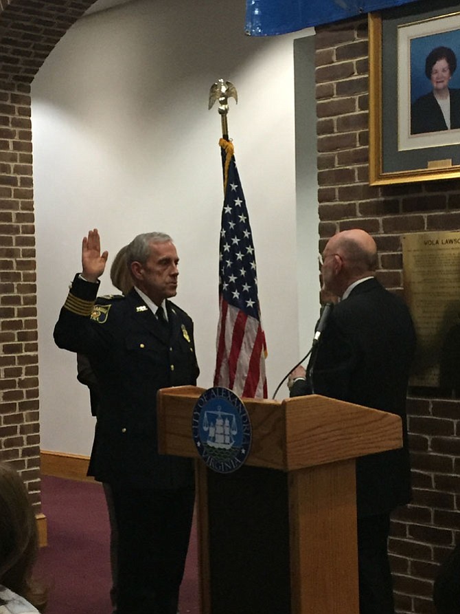 Michael Brown is sworn is as Alexandria Chief of Police Jan. 24 in the Vola Lawson Lobby of City Hall. Administering the oath to Chief Brown is Clerk of the Court Ed Semonian.