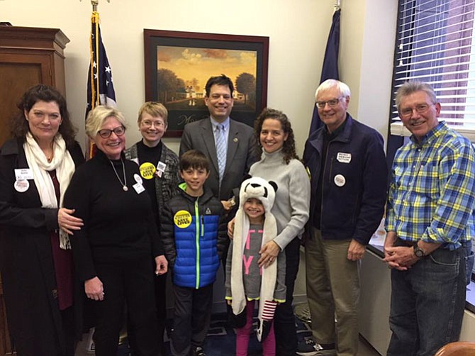 Members of the Mount Vernon Unitarian Church meet with (center) state Sen. Scott Surovell (D-36) in Richmond.