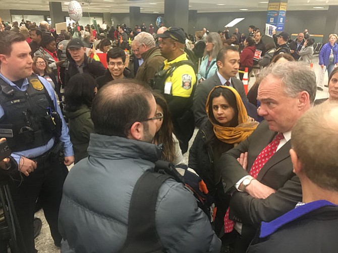 Gov. Terry McAuliffe appeared and spoke at the airport Saturday. U.S. Sen. Tim Kaine (right) visited the ongoing demonstration Monday afternoon.
