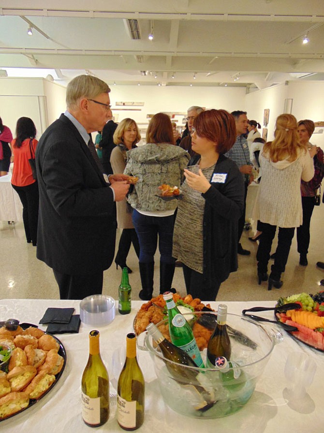 Dranesville District Supervisor John Foust chats with Alina LeMay, Board Member with the New Dominion Woman's Club, during the Arts Night Out on Thursday, Jan. 26, 2017. The event was hosted by NDWC and the McLean Project for the Arts at the McLean Community Center on Ingleside Avenue.