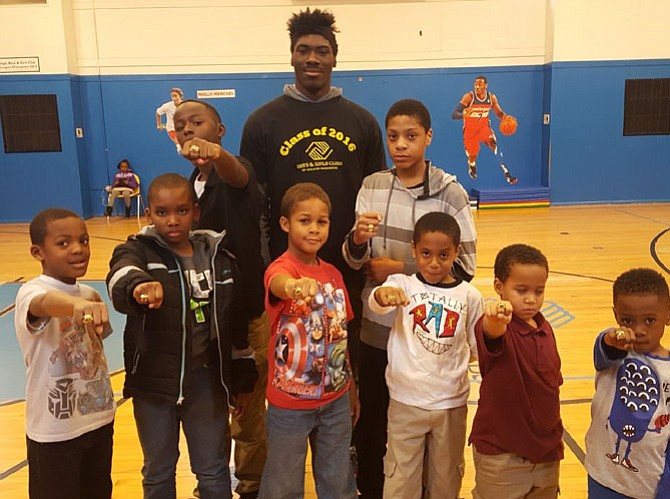 Members of the flag football winning “Miami Dolphins” team of the Dunbar Alexandria-Olympic Boys and Girls Club show off their Super Bowl rings at a recent assembly. A fundraiser for the club will be held Feb. 10 at the Carlyle Club.