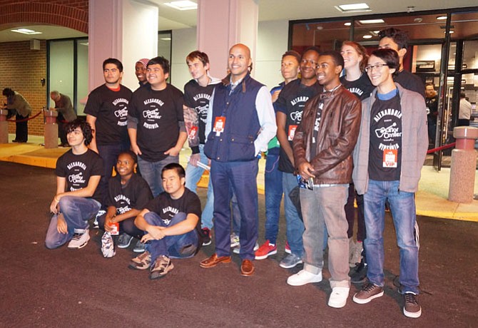 Musicians from T.C. Williams High School pose for a group photo after performing at the grand opening of the Guitar Center Jan. 12 at Alexandria Commons Shopping Center.