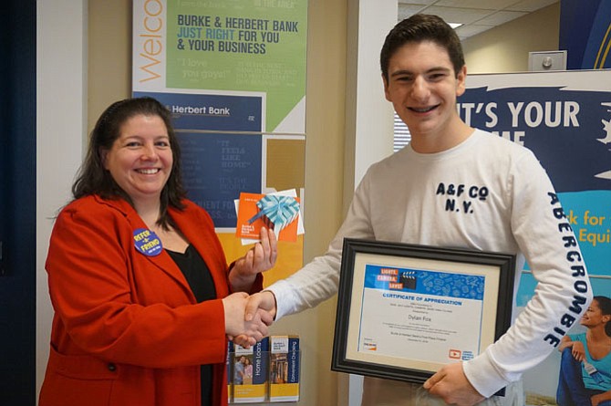 Dylan J. Fox, of Lake Braddock Secondary School, with Burke & Herbert Bank’s branch manager Christina Alvino.