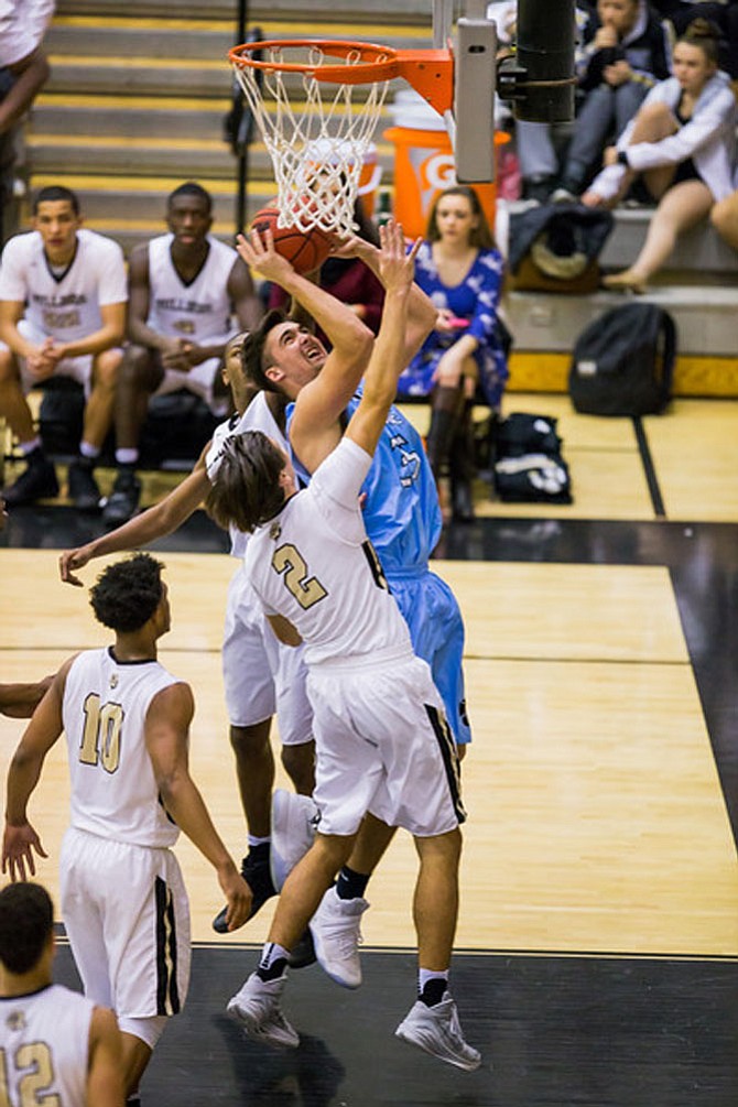 Tyler Lohman #35 of Centreville is defended by Sean Eckert #2 of Westfield.