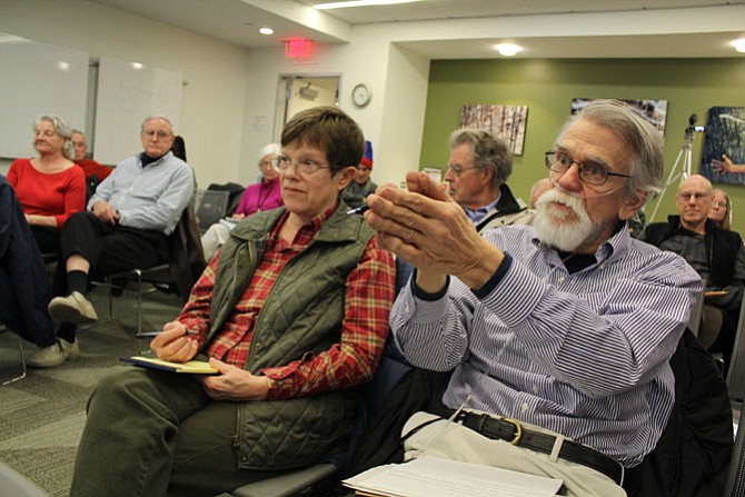 Reston neighbors Cathy Waters, left, and Joe Toussaint, right, vent their frustration that the Reston Association has control of the publication of the independent investigation’s report.
