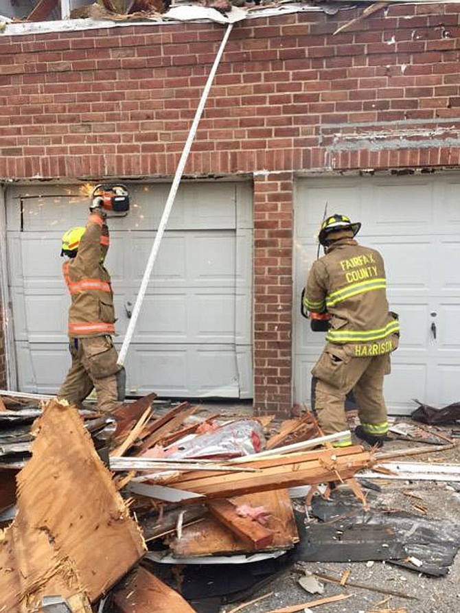 Firefighters practice their skills on a building offered for training.