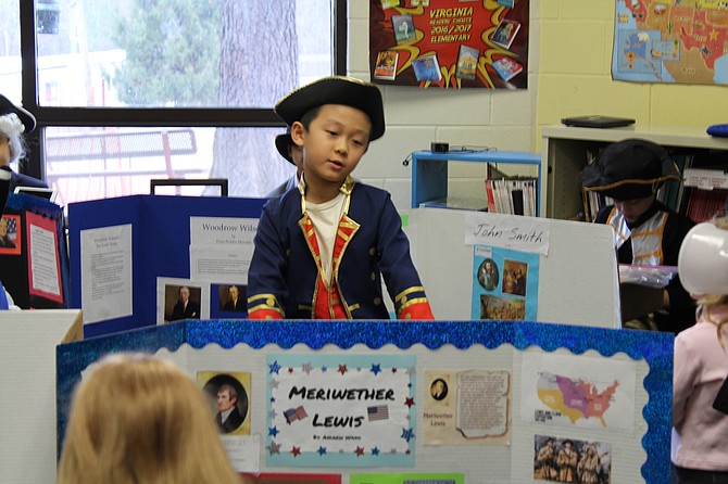 Student Andrew Wang recites his speech for a crowd of parents as Meriwether Lewis who was born in Albemarle County, Va., on Aug. 18, 1774. “I like exploring,” Wang says. The subject for his project is best known for his role as the leader of the Lewis and Clark Expedition.