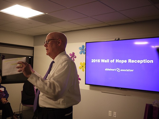 Chris Boullire welcomes fundraisers from around the area to the Wall of Hope reception, handing out awards for fundraising “champions.” 