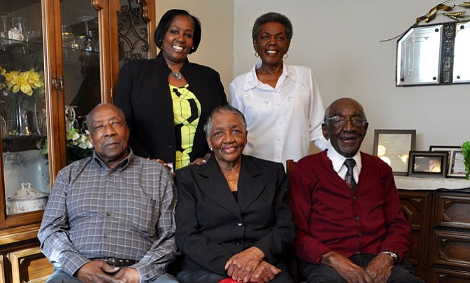 The family of 100-year-old patriarch William Charity, seated at right, will be honored March 4 at the 2017 Senior Services of Alexandria Generation to Generation Gala. Recognized with Charity will be his daughter DeeDee Marshall, sister Marjorie Burts and her husband Albert, and their daughter Kendra Gleaton.
