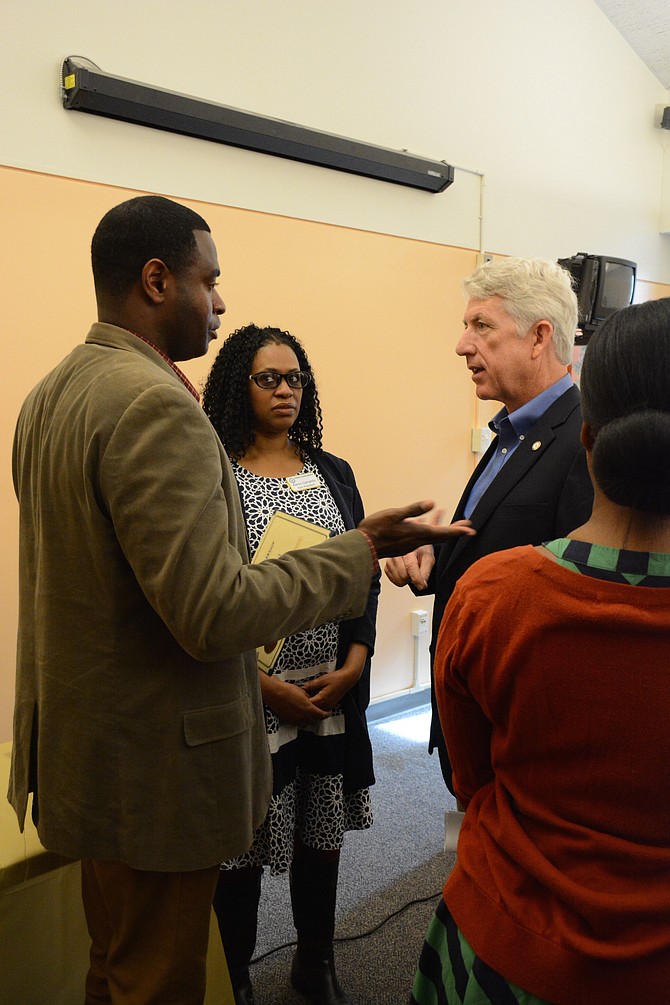 Attorney General Mark Herring (right) meets with Fairfax County NAACP president Kofi Annan (left) and vice president Karen Campblin (center) during the Feb. 25 NAACP Fairfax community gathering and Black History Month commemoration at Kings Park Library.