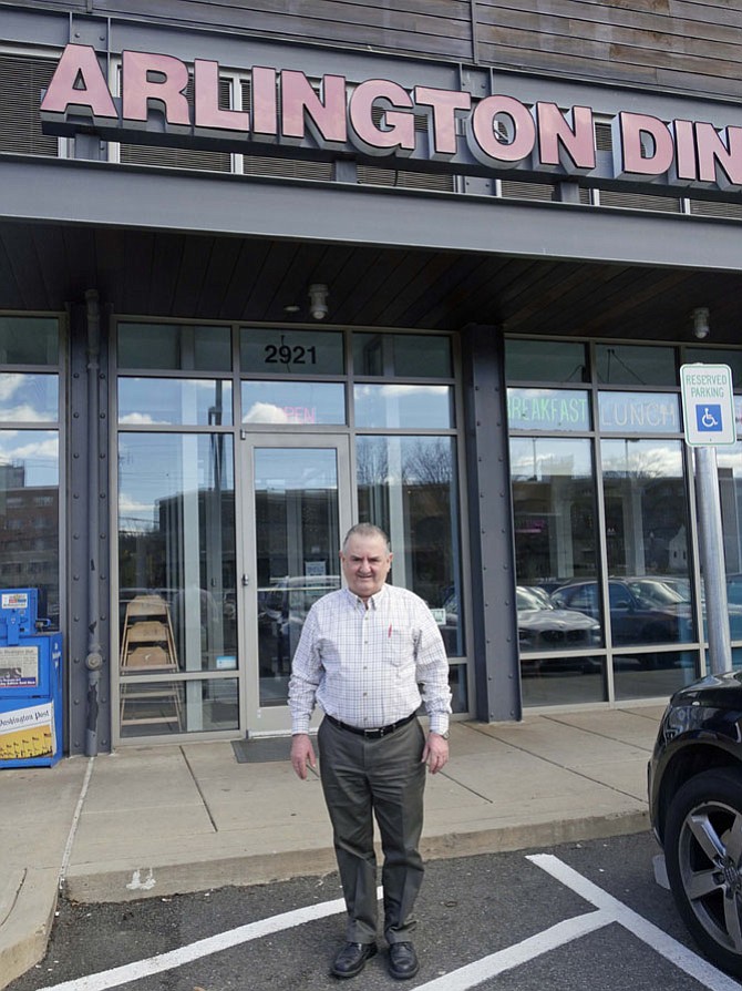 Louie Alpos stands outside the Arlington Diner where, except for a few short trips home to Greece, he has spent 364 days a year for 32 years. The diner is scheduled to close "probably the third week in May."