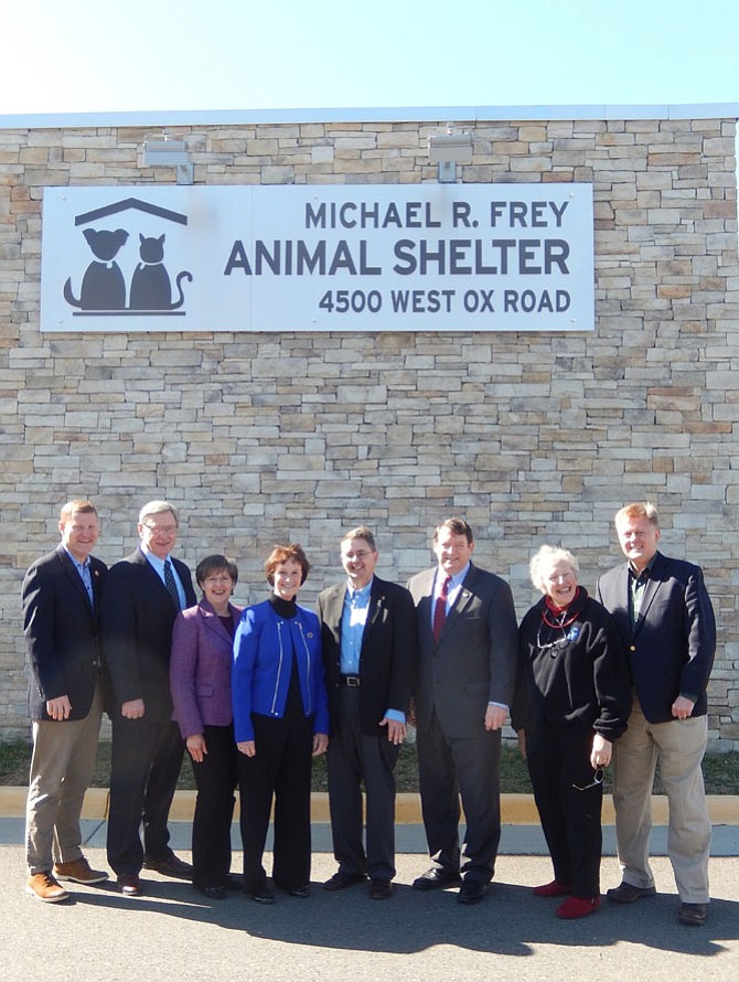 From left are Supervisors Jeff McKay, John Foust, Kathy Smith, Sharon Bulova, Michael Frey, Pat Herrity, Penny Gross and John Cook outside the newly renamed animal shelter.