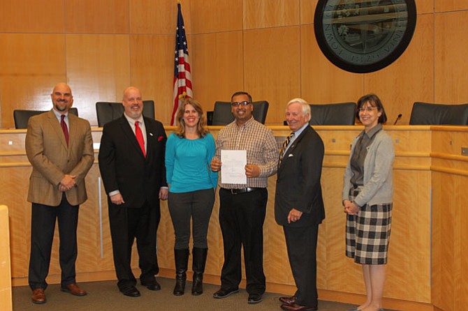 Hiren Shah (center with glasses), was appointed to the town of Herndon’s Architectural Review and Heritage Preservation Review boards and was administered his oath of office on Tuesday, March 7. 
