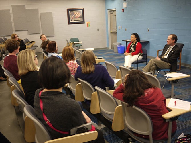 Dr. Kristi Murphy (left), assistant superintendent of human resources for APS, and APS Superintendent Dr. Pat Murphy address an information session for parents and community members at Yorktown High School. 