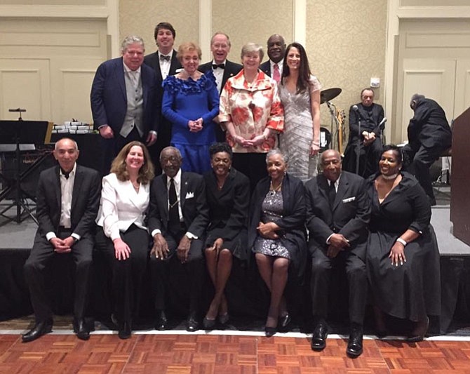 Honorees gather for a group photo at the Senior Services of Alexandria Generation to Generation Gala March 4 at the Hilton Alexandria Mark Center. Pictured in back are: Jack Taylor, John Taylor, Fran and Gant Redmon, Mary Lee Anderson, Lynnwood Campbell and Donna Shaw. In front: Habib Azmi, Mayor Allison Silberberg, William Charity, Diane Marshall, Marjorie and Albert Burts and Kendra Gleaton.
