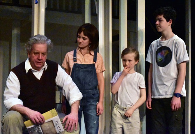 From left: Robert Heinly (as Atticus Finch), Caden Mitchell (Dill), Sophia Manicone (Scout) and Brendan Dure (Jem) in a scene from the Providence Players production of “To Kill a Mockingbird” at the James Lee Community Center Theater 
