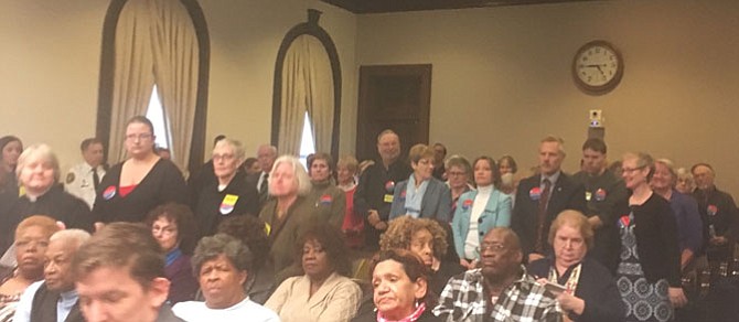 Members of Housing Alexandria and VOICE stand at the March 13 public budget hearing to support additional funding for the Episcopal Church of the Resurrection’s proposed affordable housing project. Housing Alexandria and VOICE are two broad-based coalitions, together including nonprofits, religious congregations, and other community institutions and advocates.