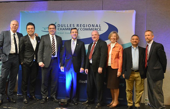 From left are James Lawson, chairman of the board, Dulles Regional Chamber of Commerce; Arsalan Lutfi, SVP, creative director, TriVision Creative; Jeff W. Dick, chairman and CEO of MainStreet Bancshares, Inc. and MainStreet Bank; Michael Pocalyko, CEO of Monticello Capital; Dr. Terry Clower, Northern Virginia chair and professor of public policy at George Mason University; Eileen Curtis, president/CEO of Dulles Regional Chamber of Commerce; Praduman Jain, CEO, Vibrent Health; and Doug Guernsey, EVP/COO at Guernsey Office Products
