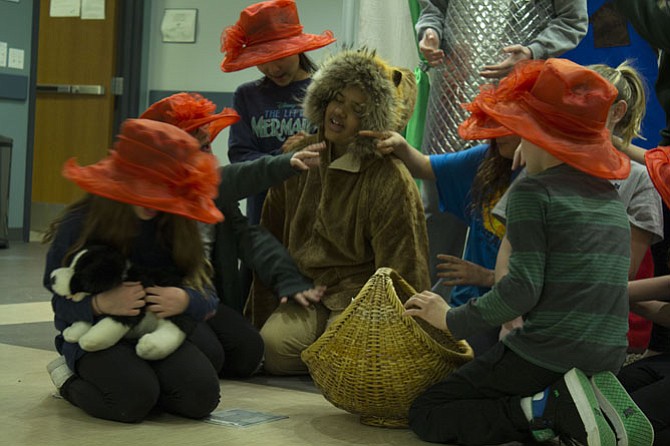 Isabella Jackson of Fairfax, who plays the Lion, falls fast asleep under the spell of the flowers, played by Catie Barry, Brett Beale, Daisy Hamilton, Charlotte Knight and Audrey Zecca.