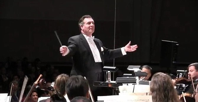 Paul Frank, shown conducting the McLean Orchestra, died March 13 at the age of 76.