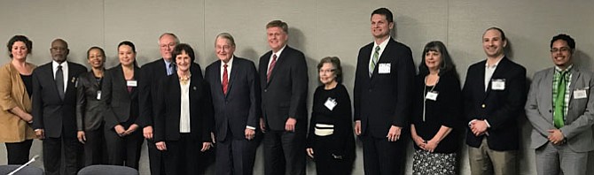 The nine members of the Civilian Review Panel marked with *: Gerarda Culipher, Deputy Clerk of the Circuit Court; Randy Sayles,* Oak Hill; Rhonda VanLowe,* Reston; Kathleen Davis-Siudut,* Springfield; Adrian Steel,* McLean, chairman of the panel; Sharon Bulova, chairman of the Board of Supervisors; Judge William Webster; Supervisor John Cook, chairman of Public Safety Committee; Jean Senseman,* Lorton; Douglas Kay,* Fairfax; Hollye Doane,* Oakton; Steve Descano,* Springfield; and Hansel Aguilar,* Fairfax.
