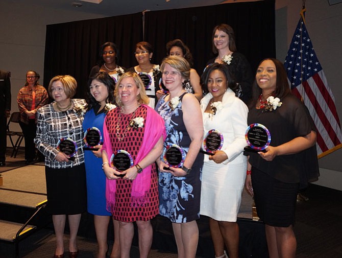 Award winners pose for a group photo March 20 at the 2017 Salute to Women Awards at the U.S. Patent and Trademark Office. Pictured in front: Dorathea Peters, Lisette Torres, Martha Carucci, Laurie MacNamara, Patricia Paxton, and Lavon Curtis. In back: Kendallee Walker, Yolanda Carrasco, Mildred Rivera, and Lisa Smith.
