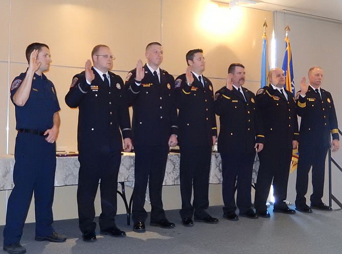 Newly promoted firefighters take their oath.