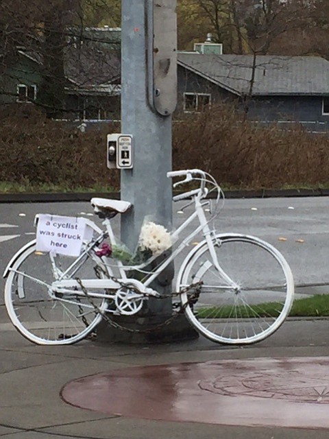 A “ghost bike” is left by mourners at the intersection where Eric Weight was killed when he collided with a pickup truck in Bellingham, Wash.
