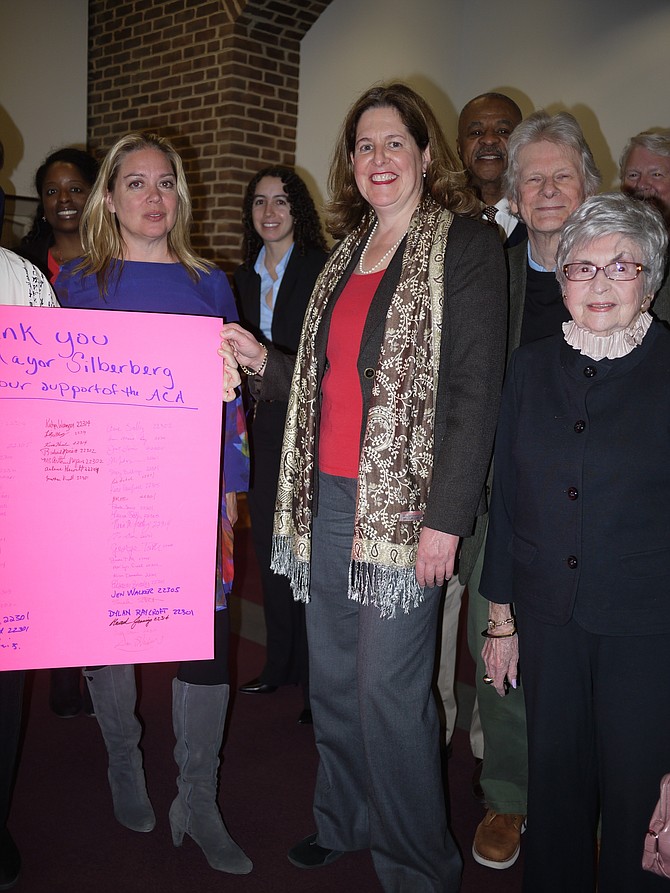Community activists in Alexandria thanked Mayor Allison Silberberg for her decision to sign the Cities Thrive letter denouncing the GOP Health Care bill (that was since defeated). From right are Dan Hawkins; Arlene Hewitt; Richard Merritt; Mac Meyers; Silberberg; Elizabeth C. Ghandakly, health commissioner; Katya Wanzer, Chair of the Public Health Advisory Commission; and Lauren Tamara Wilson, public health commissioner. 