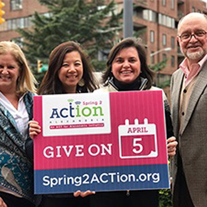 ACT for Alexandria president and CEO John Porter, right, and ACT staff promote the upcoming Spring2ACTion day April 5.
