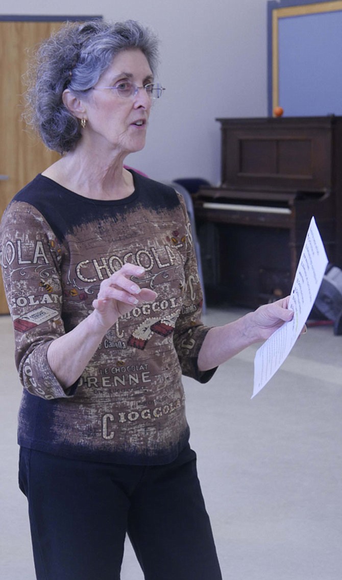 Fran Field, contra dance instructor at Lee Senior Center, leads a workshop for beginners before the dancing session begins.