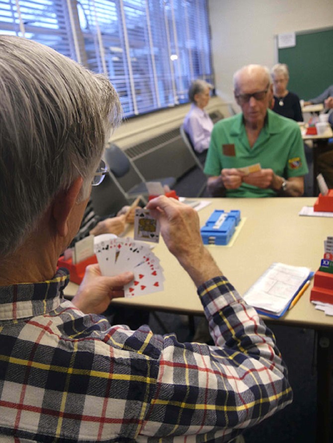 Duplicate bridge players concentrate on their next move at the regular ACBL-sanctioned games held Friday mornings from 10 a.m.-2 p.m. at Madison Senior Center.