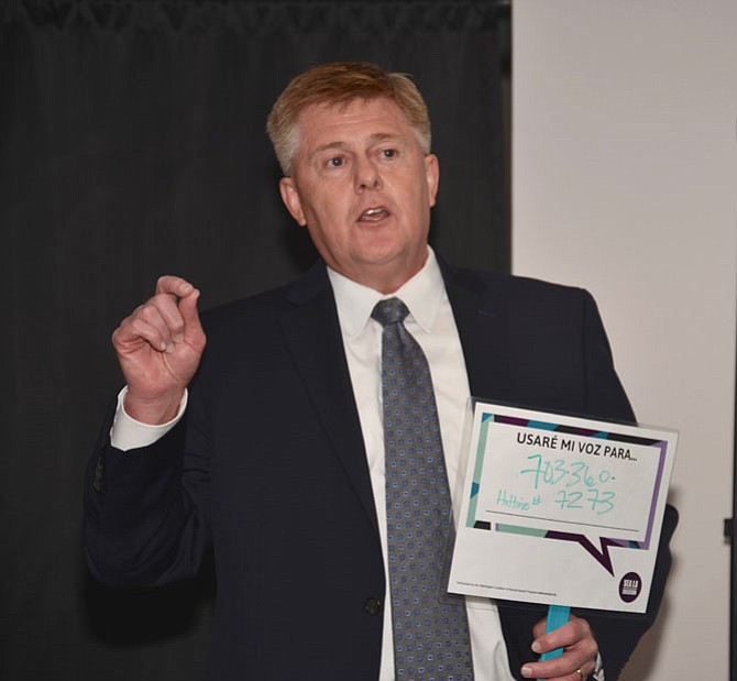 Supervisor John Cook (R-Braddock) helps launch the “Make a Call” campaign to encourage use of the 24-7 Domestic and Sexual Violence Hotline. Cook is holding the Spanish version of signage that says “Be part of the solution, use my voice for 703-360-7273.”