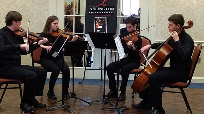 From left: Maxwell Herrmann and Malina Nelson play violin with Billy Holtz on the viola and Jacob Levy on the cello. 