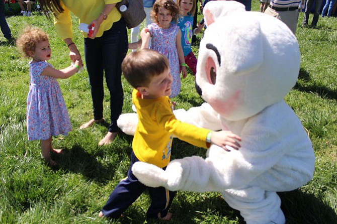 Conner Donlon, 3, of Reston gets a hug from the Easter Bunny at the Great Falls Annual Children’s Spring Festival.