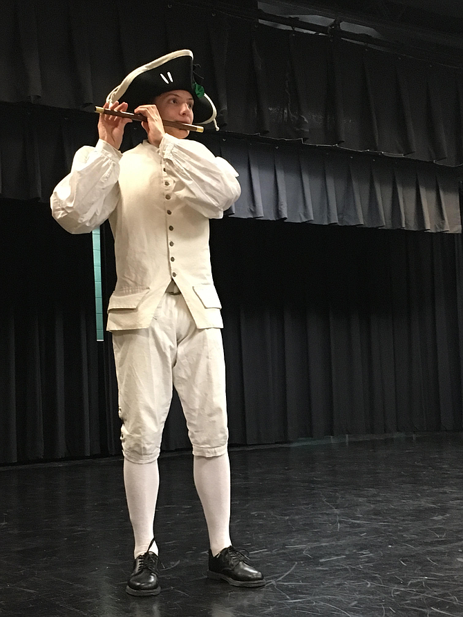 Eighth grade student Will Settle represents the Yorktown Fife and Drum Corps.