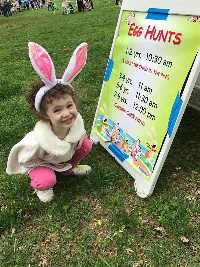 Anna Ford was delighted with the sign directing families to the Easter Egg Hunt at Nottoway Park held Saturday, April 15. Michael Ford, Anna's dad, said, "Anna came last year and got a little. This year, her candy palate has matured." 
