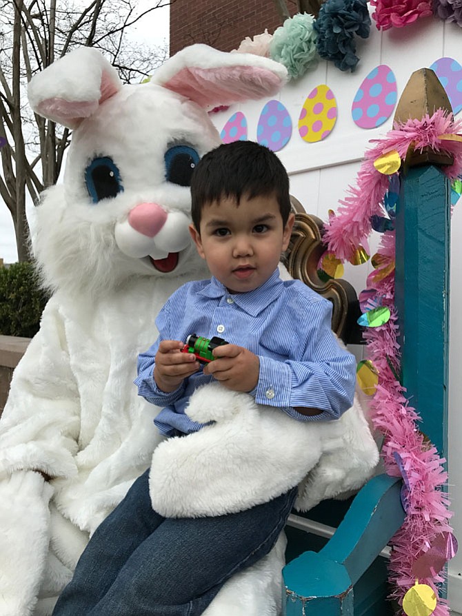 Ethan J. Meller, 2, climbed up on the Easter Rabbit's lap at the Herndon Easter Egg Hunt produced by Parks and Recreation. The event was held Sat., April 15 on the Town Green behind the Municipal Center.