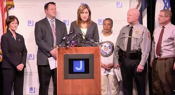 On April 13, Fairfax County Police public relations bureau director Julie Parker (center) announces the arrest of Dylan Mahone of Annandale in connection with three hate-motivated incidents at the Jewish Community Center of Virginia and Little River United Church of Christ.