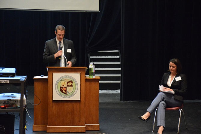 From left, VDOT project managers Mark Gibney and Amanda Baxter lead a public information meeting on the widening of Route 1 from Jeff Todd Way to Napper Road at Mount Vernon High School on April 18.