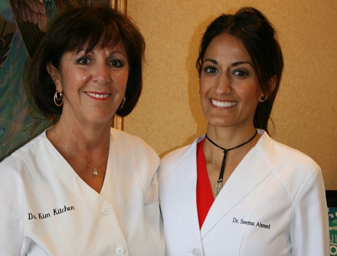 From left are Dr. Kim Kitchen and Dr. Seema Ahmed, at Old Town Smiles, 500 Montgomery St., Alexandria. Together, “We try to and do at least four to six full mouth makeover cases every year,” said Kitchen.