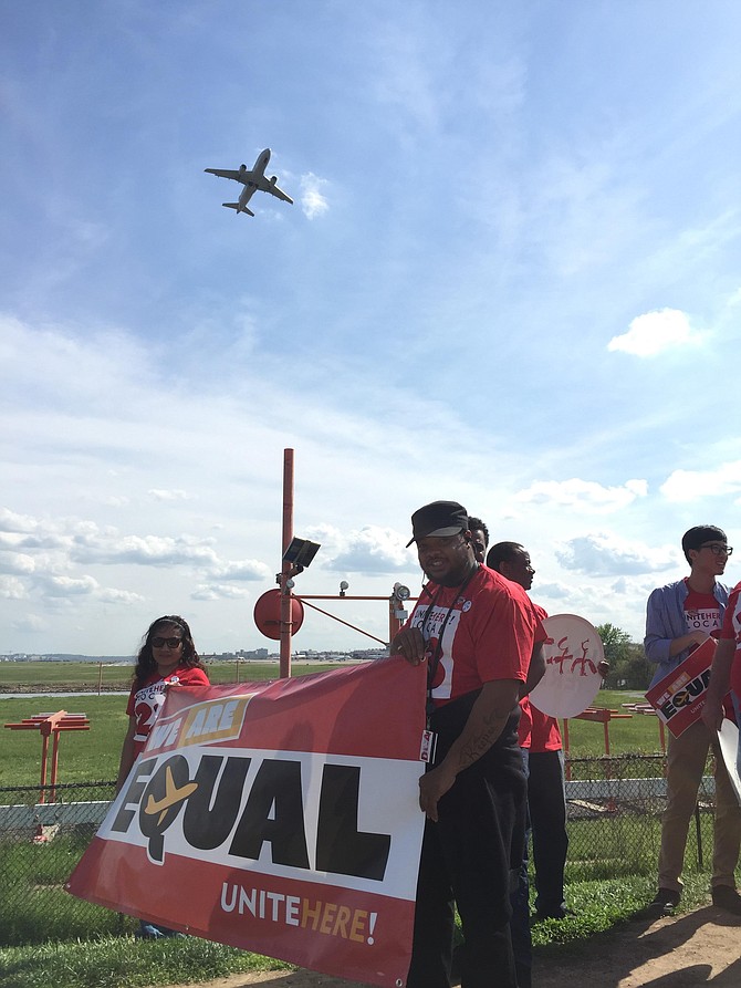 Airport workers march for higher pay at Gravelly Point Park.