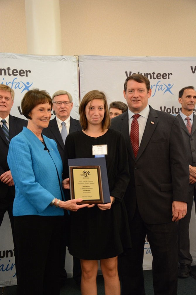 (Left) Sharon Bulova and (right) Supervisor Pat Herrity (R-Springfield) present Emma Houston (center) of Centreville the Volunteer Fairfax Service award for Youth Volunteer. Houston is a volunteer leader with the Northern Virginia Therapeutic Riding Program where she supervises the care of 14 therapy horses and manages a crew of up to 20 other volunteers.