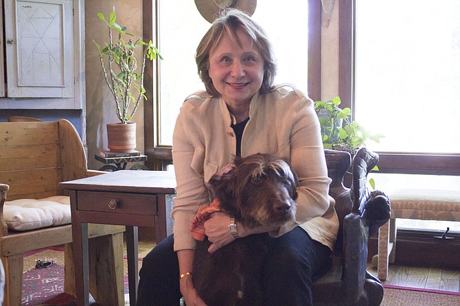 Susan Platt and her labradoodle named Twix, one of her five dogs, at her home in Great Falls just days before absentee voting began for the June 13 primary elections.