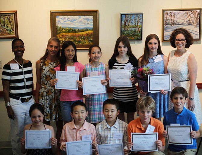 Great Falls Writer's Group founder Kristin Clark Taylor believes in the value, worth, and staying power of the students' words. She told the finalists she hopes the writing contest experience helps them recognize the impact of their written words for the rest of their lives. Pictured in the top row are Taylor, guest speaker Sophie Tedesco, Helen Fu, Carly Hill, Katie Merrill, first-place winner Natalie Hutchinson, and Friends of the Great Falls Library president Michelle Miller. Bottom row: Morgan Frederick, Danniel Cao, Bradley Cao, second-place winner Thomas Buckley, and third-place winner Connor Oakes. Not pictured is Ann Shen.