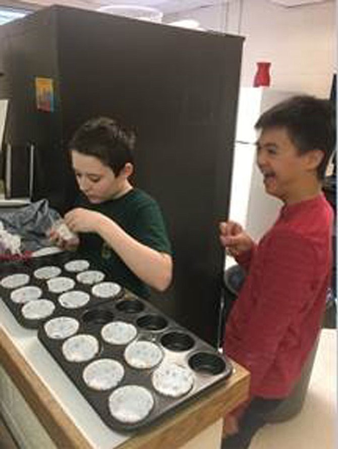 Having fun preparing muffins: Christian Crane and Nate Hong.